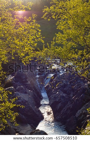 Sunlit water stream near Bridge of Orchy - Walking the West Highland Way in Scotland