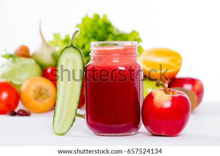 vegetable smoothie in a glass on a background of vegetables. healthy lifestyle. Healthy eating. Cucumber, apple. Fruit and vegetable