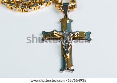 
Cross with chain on white background