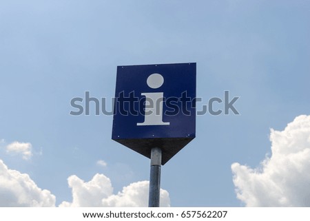Info point symbol with blue sky in the background