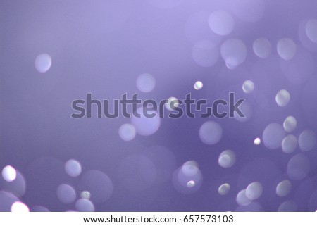 A beautiful and blurry bokeh on a purple background.