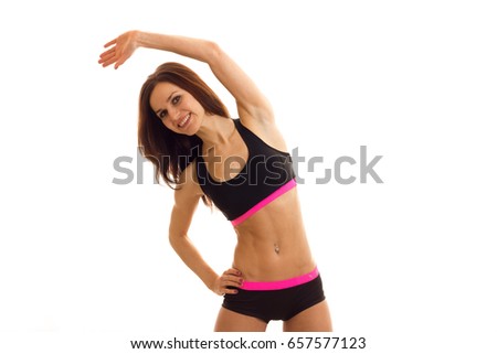 young brunette woman makes exercices and smiling
