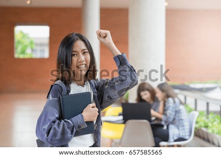 Portrait cute asian student college in happy action with teenager student background. Education concept.