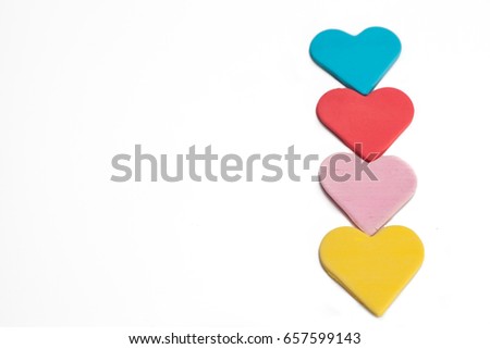 Heart shaped colored sugar isolated on white