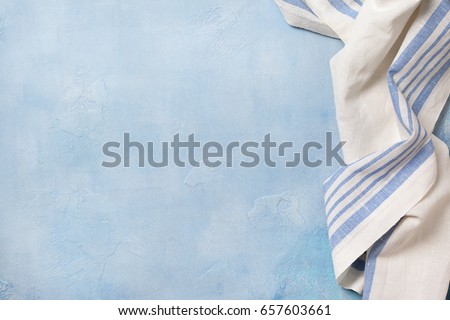 Blue concrete background (backdrop) with a napkin. view from above. Copy space Royalty-Free Stock Photo #657603661