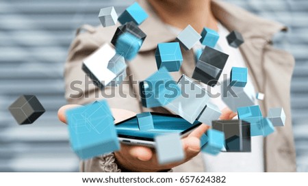 Businessman on blurred background holding floating blue shiny cube network 3D rendering