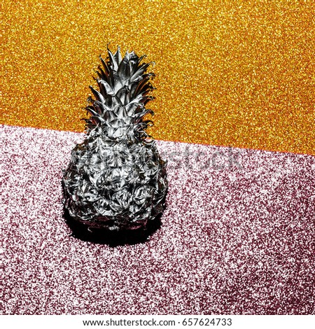 Silver pineapple on a shiny background. Minimal