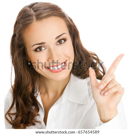 Happy smiling young business woman showing blank area for sign or copyspase, isolated over white background