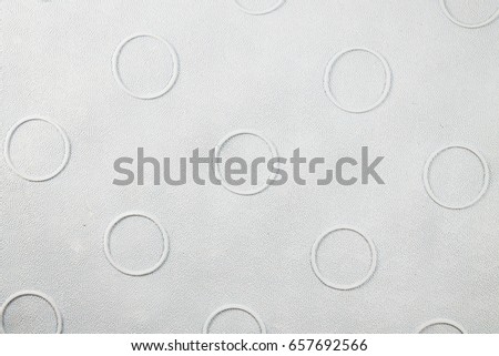 Rubber mat for bath or yoga close-up. Rubber textures and products from it. Circles on the carpet close-up, macro picture of rubber.