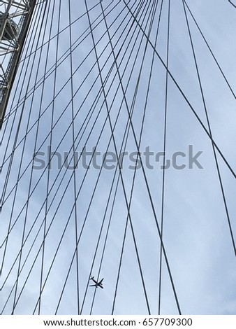 Airplane fly through the sky with the busy complicated wire background.