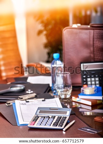 Business still life with stationery on table in office. Workplace of the accountant.backlight