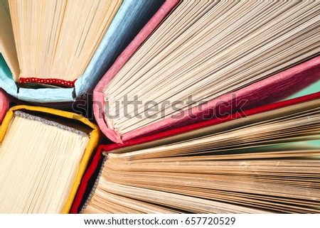 Top view of colorful hardback books in a circle. free copy space. Back to school copy space. Education background.