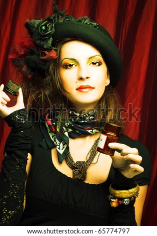 Portrait of young woman with creative visage and in vintage hat.