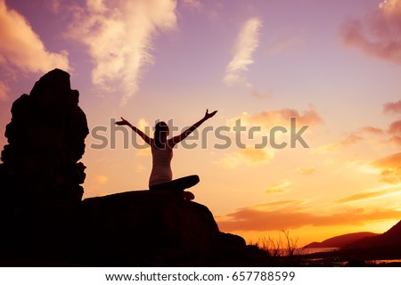 Woman sitting outdoors feeling happy and free!