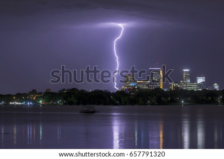 A Telephoto Shot of a Single Bolt of Lightning and the Skyline Reflecting in South Minneapolis' Bde Maka Ska Lake, or Lake Calhoun, on a Summer Night