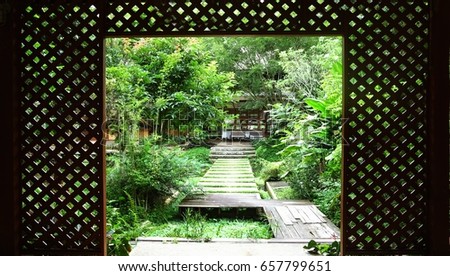 The wood gate  and way  to the beautiful garden