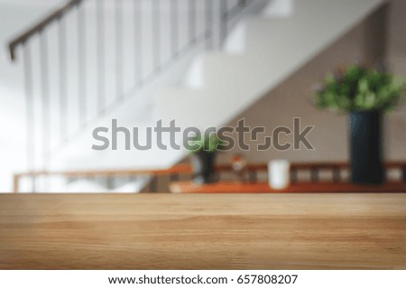 wooden table with blurred white restaurant or cafe background