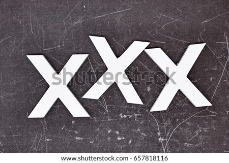 A studio photo of naughts and crosses
