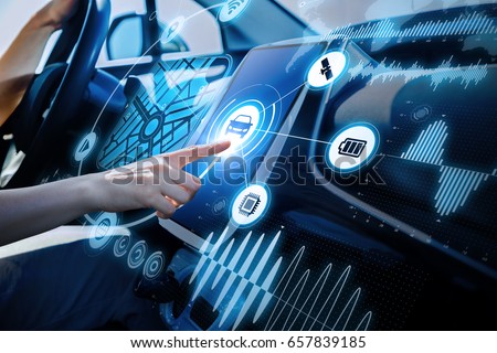 futuristic vehicle and graphical user interface(GUI). intelligent car. connected car. Internet of Things. Heads up display(HUD). Royalty-Free Stock Photo #657839185
