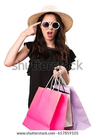Beautiful young girl  with shopping bag making crazy gesture