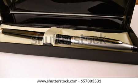 stylish black and silver pen with stylish box in white background