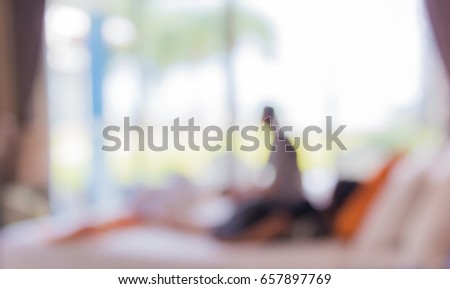 Abstract blur image of Bedroom decorated interior with bokeh for background usage .