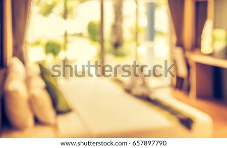 Abstract blur image of Bedroom decorated interior with bokeh for background usage . (vintage tone)