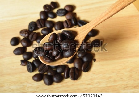 Coffee beans and ground powder on background. Top view.