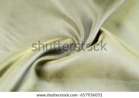 Texture background pattern. Fabric silk khaki, green, field gray, golden, olive, pear-colored.