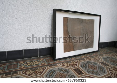 old broken picture frame on vintage floor