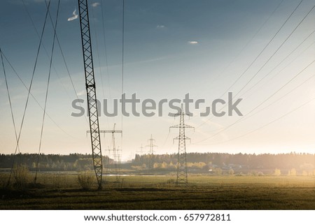 high voltage post.High voltage tower at sunset sky background.