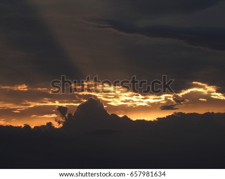 Evening Sunset Black clouds with gold color shiny edges, Beauty of  Black clouds, 