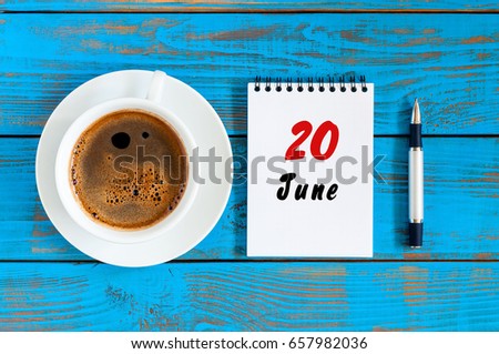 June 20th. Image of june 20 , daily calendar on blue background with morning coffee cup. Summer day, Top view