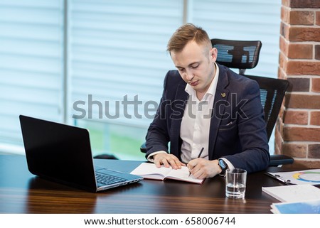 Close up businessman signing documents or contract