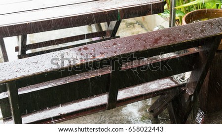 raining on the wood chair