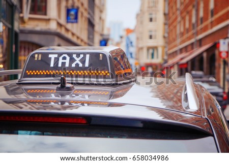 Taxi roof sign on car, closeup