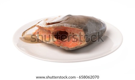 plate of salmon head isolated on white background