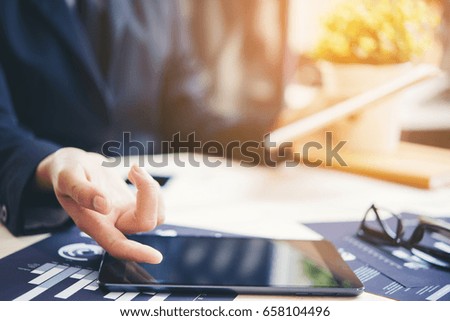 Image of business hands using tablet at office