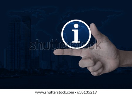 Information sign icon on finger over world map and modern city tower, Business communication concept, Elements of this image furnished by NASA