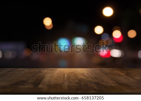 Empty wooden table in front of abstract blurred background of coffee shop . can be used for display or montage your products.Mock up for display of product Royalty-Free Stock Photo #658137205