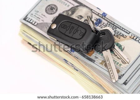 car key with us dollar on white backgrounds
