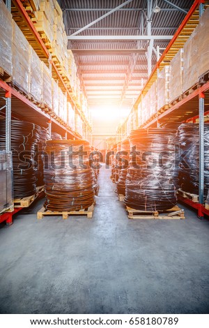 Warehouse industrial and logistics companies. Coiled plastic pipe. Toning the image. Bright sunlight.