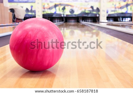 Pink ball on floor in bowling club
