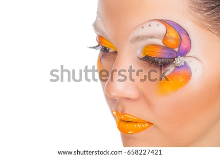 The beautiful girl with a creative flower make-up on face. On white background