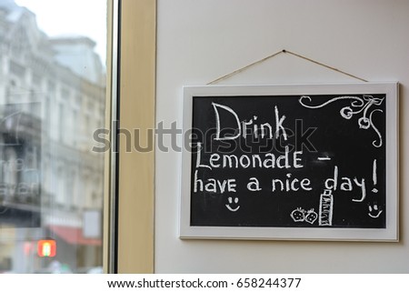 Chalk on the blackboard Drink lemonade have a nice day