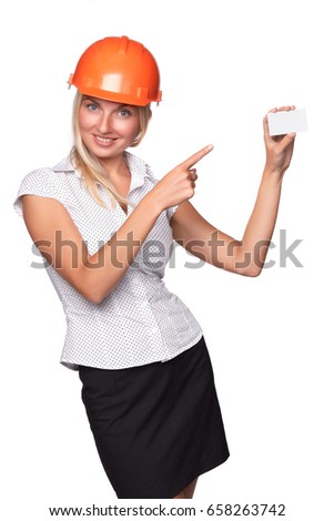 Female architect in a hard hat showing a blank business card on a white background