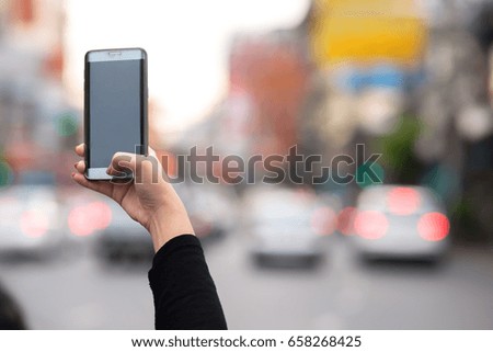 Girl shooting a picture with smartphone on sightseeing