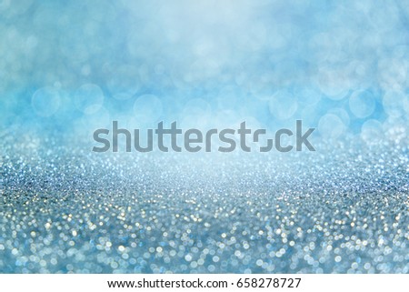 festive abstract glitter bokeh of blue background