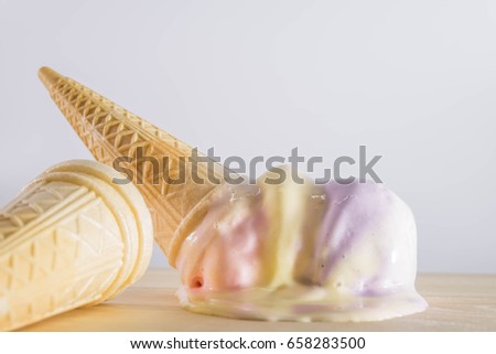Ice cream cones are melting Royalty-Free Stock Photo #658283500