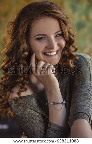 Beautiful redhead girl with curly hair